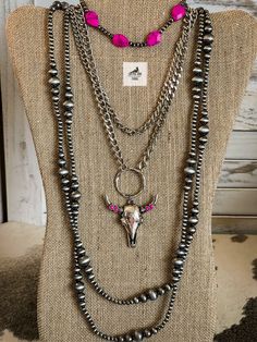 Add a touch of Western charm with our Pink Longhorn Necklace. Featuring a striking bull skull cow head steer pendant, this double-layer silver chain necklace exudes rustic elegance. Make a statement with a dash of pink in your cowgirl style! Pink Western jewelry, western aesthetic, western fashion, western outfits, western style, western, western fashion outfits, western concert outfit, western fits, western accessories, western style outfit, western choker necklace Fashion Outfits Western, Western Choker Necklace, Longhorn Necklace