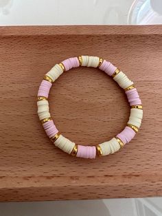 this is a really cute, preppy, and aesthetic pastel yellow and pink clay bead bracelet with some cute gold charms in to give it that extra sparkle 🌟 Aesthetic Pastel Yellow, Preppy And Aesthetic, Pink Clay Bead Bracelet, Cute Preppy Aesthetic, Pulseras Kandi, Make Clay Beads, Pastel Outfits, Colorful Bead Bracelets, Clay Bracelets