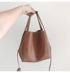 Buy Online Leather Bucket Bag with Shoulder Strap and Inner Pouch Casual Faux Leather Bucket Bag With Large Capacity, Casual Large Capacity Faux Leather Bucket Bag, Solid Color Bucket Hobo Bag For Office, Trendy Brown Bucket Bag For Daily Use, Trendy Brown Bucket Bag For Office, Trendy Brown Office Bucket Bag, Office Bucket Bag, Solid Color Bucket Hobo Bag With Adjustable Strap, Adjustable Strap Bucket Hobo Bag