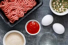 raw meat, eggs and other ingredients on a table