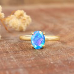 Blue fire Ethiopian opal ring for women, minimalist ring, October birthstone, AAA Ethiopian opal ring, 925 Sterling silver ring, Gold ring, gift for her. *Other Similar Jewelry Available Here* https://www.etsy.com/shop/AreebaJewelry Details:- Gemstone - Ethiopian opal  Stone Color - Natural  Stone Setting - Prong Quality - AAA Grade Rize Size - 4 US TO 9 US Available Type - 100% Natural  Shipping service - Free worldwide shipping service About AreebaJewelry:- AreebaJewelry takes great pride in t Minimalist Opal Birthstone Promise Ring, Minimalist Opal Rings With Gemstone, Opal Birthstone Jewelry In Open Ring Shape, Opal Birthstone Open Ring Jewelry, Minimalist Opal Rings With Birthstone, Minimalist Opal Ring With Birthstone, Minimalist Opal Birthstone Ring For Anniversary, Minimalist Opal Ring As A Gift, Opal Solitaire Promise Ring