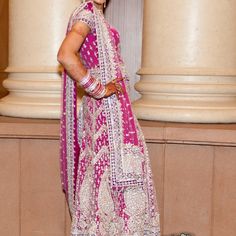 Light Pink Net Lehenga Worn Once With Silver Stone/ Gota Patti Work All Over. The Lehenga Is Detailed Intricate Work Fully Embroidered Front/ Back Comes With Straps To Hold The Weight Of Lehenga. It Includes Hints Of Baby Pink And Purple, Comes With Matching Stone Top With A Zipper. Blouse Border Cut Out Design Both Sides. With Heavy Border Chunni, And Silver Beads. Measurements: Top- Bust 37, Waist 34, Length 20 Lehenga Length: 47. Includes Zipper, Margins 2’ Each Side Outfits Will Not Fit Into A Standard Size Category, All Of The Outfits Are Custom Made. *Most Outfits Are Pre Worn Unless Stated. Worn Items Will Show A Few Signs Of Wear Including Minor Stains, Missing Stones Around The Silver Bollywood Salwar Kameez For Diwali, Silver Bollywood Sharara With Traditional Drape, Traditional Silver Sharara For Reception, Bollywood Silver Sharara With Traditional Drape, Traditional Silver Salwar Kameez For Wedding, Silver Traditional Wear With Cutdana For Reception, Silver Cutdana Traditional Wear For Reception, Silver Traditional Wear With Mirror Work, Silver Sharara With Zari Work And Traditional Drape