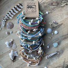 Handmade surf bands are made from durable wax cotton and adorable shells  Each comes in a set of five bands, the colours are inspired by some of our favourite beaches!  * Culi Bay - west Coast of Scotland * Fistral - Cornwall * Tempest Vane - Seaham  * Krackington Haven - Cornwall * Coldingham Bay - Scottish Borders  * New Asgard Port - East Coast Scotland  * Summerleaze Beach - Cornwall Perfect for friendship bracelets, finishing your boho look or as gifts for friends!  All are tied with a slip New Asgard, West Coast Scotland, Bracelet Sets, Snake Bracelet, Beaded Cuff, Bracelet Online, Delica Beads, Boho Look, Beach Vibes