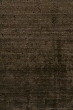 Hand-knotted rug with viscose fibers. Dark Brown Rug, Jake Arnold, Viscose Rug, Rug Guide, Lulu And Georgia, Solid Rugs, Brown Rug, Home Rugs, Rug Cleaning