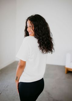 Short Sleeve crew neck graphic tee, loose in all the right places. Featuring an open neckline with slightly dropped sleeves. Made in our soft 100% cotton fabrication. Serenity is wearing a size small. Measurements: Body Length: 30" | Sleeve Length: 9" Small: Bust: 38" Arm: 16" Medium: Bust: 39" Arm: 17" Large: Bust: 43" Arm: 17.5" XL: Bust: 48" Arm: 18" 100% Cotton Effortless Crew Neck Soft-washed T-shirt, Effortless Soft-washed Crew Neck T-shirt, White Relaxed Fit Graphic Cropped T-shirt, White Relaxed Short Sleeve T-shirt, Relaxed Crew Neck Short Sleeve Top For Everyday, Oversized Effortless Crew Neck T-shirt, Oversized Effortless T-shirt With Crew Neck, Trendy White Organic Cotton Tops, Relaxed Soft-washed White Top