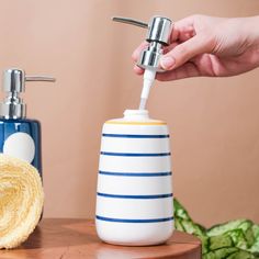 a person is using a soap dispenser to clean their hand and face