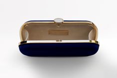 The Navy Bella Clutch is a custom designer clutch, and a timeless choice for an elegant wedding handbag. We’ve found your something blue… Your bridal purse. The Navy Bella Clutch is the perfect option for an evening wedding, as the duchess satin feels luxurious and sensible, without sacrificing style. Perhaps you’re celebrating on the New England coast at a chic hotel or private estate, complete your look with a stylish and elevated custom purse that you’ll love for years to come. The Bella Clut Luxury Evening Bag With Removable Pouch In Rectangular Case, Luxury Evening Bag With Removable Pouch, Luxury Rectangular Clutch With Detachable Handle, Luxury Clutch With Detachable Handle, Rectangular Case, Luxury Evening Bag With Detachable Handle, Designer Rectangular Case Evening Bag, Blue Formal Bags With Rectangular Case, Blue Rectangular Case Bag For Formal Occasions, Formal Blue Rectangular Case Bag