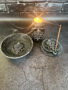 three candles sitting next to each other on a table