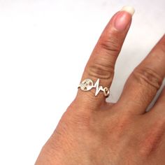 Silver Radiologic Technologist Heartbeat Ring is handmade with its own uniqueness. It can be bought as a gift for any occasion like birthday gift, wedding gift, travel gift, souvenir and etc. If you need rose gold plating or yellow gold plating, please contact us, we will advice you on the additional fees applicable. Base Material: Sterling Silver Size: 15mm X 9mm (Approximately) Ring Size: US 4 - US 14 (Please sellect your size) Metal Stamped: 925 Crafting Time: 7 - 10 working days Thickness: 1 Silver Adjustable Heart Ring For Gift, Adjustable Silver Heart Ring For Gift, Silver Adjustable Heart Ring As Gift, Personalized White Heart Ring As A Gift, Unique Handmade Heart Ring For Gift, Unique Handmade Heart Ring As Gift, Unique Handmade Heart Ring Gift, Symbolic Adjustable Heart Ring As Gift, Symbolic Heart Ring For Valentine's Day Gift