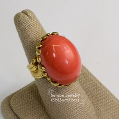 This large striking Japanese Momo Coral Ring is set in 18k solid gold. Ring Size: 5.75 Total Weight: 25.96 grams Precious Metal: 18k solid gold Precious stones: -Coral Center Stone: 25mm x 18.5mm Hallmark: 18k Gold Ring Vintage, Platinum Diamond Rings, Coral Ring, Solid Gold Ring, Jade Ring, 18k Gold Ring, Platinum Ring, Vintage Ring, Ring Vintage