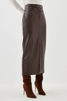 Allow this wardrobe staple to provide an instant update to everyday rotations. Crafted with premium leather, this midi skirt embraces an off-duty aesthetic, while corset-style seaming adds dimension to the piece. Belt loops and lapels add understated detailing this piece. Style this skirt with heels and a crop top to exude understated elegance at your next event.Midi hemlineLeatherFront leg slitZip fastening Leather Pencil Skirt Outfit, Midaxi Skirt, Maxi Pencil Skirt, Skirt Collection, Pencil Skirt Outfits, Leather Midi Skirt, Leather Pencil Skirt, Faux Leather Skirt, Understated Elegance