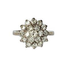 This cluster ring holds Diamonds totalling approx 1ct and are bright and sparkly. The stones are placed up high on an open work gallery, they are also set in platinum. Ring Size: L or 5 3/4 Cluster Diameter: 13mm Height From Finger: 8mm Weight: 4.5g Classic Cluster Cubic Zirconia Ring, Dazzling Cluster Rings With Single Cut Diamonds, 14k White Gold Cluster Ring With Prong Setting, Anniversary Halo Ring With Cluster Center Stone, Anniversary Cluster Halo Ring With Center Stone, Fine Jewelry Anniversary Cluster Ring With Prong Setting, Timeless 14k White Gold Cluster Ring With Prong Setting, Fine Jewelry Cluster Ring With Prong Setting For Anniversary, Anniversary Diamond Ring With Prong Setting In Cluster Shape