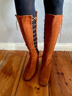 Original 1960s rust brown suede lace up boots. Lace up on both sides, very special and unique. Beautiful classic 1960s shape. The condition is perfect and the boots are unworn. Size 7 N stamped. I would say they are suitable for a Euro 38. Please check the measurements: outsole length 24.5 cm, heel 4.5 cm. I prefer insured shipping but ask for cheaper shipping rates if you don't want any insurance (on your own risk). Brown Suede Lace-up Hiking Boots, Brown Boots With Front Lace-up Fastening For Fall, Fall Brown Boots With Front Lace-up Fastening, Vintage Brown Lace-up Heeled Boots, Brown Suede Lace-up Heeled Boots, Brown Suede Lined Lace-up Boots For Fall, Vintage Knee-high Lace-up Boots For Fall, Vintage Suede Boots For Fall, Vintage Brown Lace-up Boots