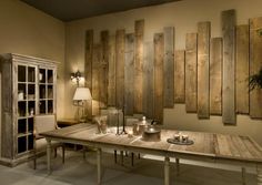 a dining room with wooden paneling on the wall and table in front of it