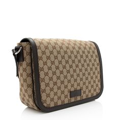 The Italian fashion house of Gucci continues to reinterpret its rich heritage under current Creative Director Alessandro Michele (2015). Maintaining a balance between historical reference and contemporary eclectic flare, the brand’s signature “double g” remains iconic. Gucci has been recognized as a worldwide leader in the luxury goods market for 90 years. Luxury Formal Shoulder Bag In Signature Coated Canvas, Luxury Formal Bags In Signature Coated Canvas, Luxury Formal Shoulder Bag In Coated Canvas, Designer Shoulder Bag With Palladium Hardware In Coated Canvas, Luxury Monogram Canvas Shoulder Bag, Luxury Beige Shoulder Bag In Signature Coated Canvas, Designer Shoulder Bag, Contemporary Eclectic, Alessandro Michele