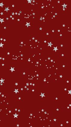 red background with silver stars on the bottom and white stars on the top, all in different sizes