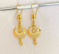 Solid gold 22k / 916 gold purity  Descriptions:- Turkish Design Dangling Earrings, 916 Gold  Solid 22k Pure Gold, Beautiful crescent Moon Dangling Earrings with, 916 Gold  GOLD PURITY : 22k pure yellow gold , 916 GOLD Colour : YELLOW GOLD Total Appx weight : 3.32 grams   Width : Appx 1.5cm - pls see pic with ruler Length : Appx 4.3 - pls see pic with ruler  Hallmark: Hallmarked 916 stamp Design : Beautiful Shining Moon Dangling Earrings with Heart Charms FAQs Q: Is it real gold? A: yes it's real 916 Gold Earrings, 22k Gold Intricate Design Drop Earrings, 22k Gold Filigree Jhumkas For Gift, 22k Yellow Gold Danglers With Intricate Design, Traditional Gold Plated Filigree Danglers, Intricate 22k Yellow Gold Danglers, Ella Eyre, Gold Jewelry Stores, Turkish Design