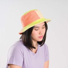 Knit bucket hat with raised contrast squiggle stripes. Made from colorful, soft hypoallergic yarn. From sunny summer beach days to cold winter walks, this bucket hat is destined for year-round wear. Each hat is one of a kind – patchwork pattern placement may vary, but that's the fun of it! Details Body: 100% Acrylic Lining: 100% Deadstock poly-cotton fabric Machine wash gentle, lay flat to reshape and dry8.5"w, 3.5"h, 2.25" brim, 22" interior circumference Casual Orange Straw Hat For Spring, Trendy Orange Bucket Hat For Summer, Trendy Orange Summer Bucket Hat, Orange Brimmed Bucket Hat For Spring, Orange Summer Bucket Hat With Curved Brim, Summer Orange Bucket Hat With Curved Brim, Multicolor Lightweight Bucket Hat For Spring, Lightweight Multicolor Bucket Hat For Spring, Orange Curved Brim Bucket Hat For Summer