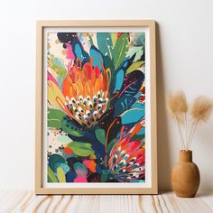 an abstract floral painting on a white wall next to a vase