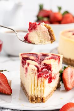 a piece of cheesecake with strawberries is being lifted by a fork