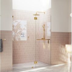 a bathroom with a walk in shower next to a sink and mirror on the wall