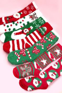 Here is cute X-mas Christmas holiday socks. These soft fluffy socks are designed to provide maximum comfort, with a soft and fluffy material that feels gentle against your skin. The socks are also designed to be lightweight and flexible, which allows you to move your feet freely without feeling constrained. You can wear with PJ or lounge wear. One Size Fits Allsize: knee high socksyarn: coral fleecematerial: polyester/spandex Cozy Christmas Socks For Gifts, Cute Christmas Gift Socks, Cozy Christmas Gift Socks, Cozy Super Soft Socks For Gifts, Cozy Super Soft Socks As Gift, Holiday Socks, Fluffy Socks, Sunglass Chain, Fuzzy Socks