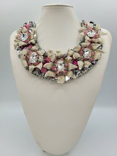 Each piece of our statement necklaces is handmade and one of a kind made in Italy. Our creations is made of high quality materials such as crystals and rhinestones. Each embroidered material is carefully hand sewn. Very glamorous and stylish. Perfect gift to someone you like. Materials Rhinestones and braked stones in Crystal, Fuchsia, Rose and Peridot color, in different shape. Round sequins in Silver metallic color. 3D Leaf in micro tubes, Silver color. Black satin fabric backing. Alluminium chain with lobster clasps closure. Measurements Weight approximate 200 grams. Chain lenght 28 cm - 11.00 in Circumference approximate 75 cm - 29.5 in Feel free to contact us if you have any questions Thank you so much for looking at our shop and our articles each of them, single piece. Belle Necklace, Black Satin Fabric, Peridot Color, Sparkle Necklace, Jewel Necklace, Anna Wintour, Swarovski Necklace, Necklace Statement, Necklace Choker