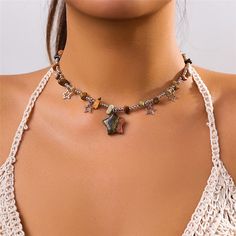 Features: Introducing the Boho Colorful Irregular Stone Choker Necklace. Made with eye-catching beads and featuring a unique hollow star pendant, this necklace is the perfect addition to any summer outfit. Elevate your style and embrace the Y2K trend with this statement jewelry piece. Bohemian Charm Necklaces With Clavicle Chain For Party, Bohemian Beaded Choker With Clavicle Chain, Bohemian Multicolor Clavicle Chain Necklace, Trendy Crystal Necklace With Beaded Chain, Trendy Adjustable Star Necklaces, Trendy Adjustable Star-shaped Necklace, Bohemian Pendant Charm Necklace For Parties, Star Charm Necklace For Summer, Casual Star Charm Jewelry