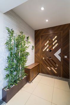 a wooden door and some plants in a room