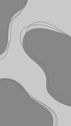 an abstract gray background with wavy lines and curves in the center, on top of a plain grey surface