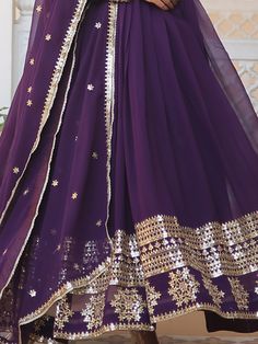 Introducing our fabulous purple sequins georgette reception wear gown with dupatta, a stunning ensemble that is perfect for any special occasion. Made from high-quality georgette material in a beautiful purple color, this gown features intricate embroidered work and multi-sequin detailing that adds a touch of elegance and sophistication.
This gown includes a similar color georgette dupatta with rich sequins embroidered work and designer lace work. The gown is fully stitched and available in size Purple Sharara For Diwali Celebration, Eid Georgette Sequin Gown, Floor-length Georgette Dupatta For Celebration, Bollywood Style Purple Chinon Sharara, Festive Purple Sharara For Celebration, Purple Semi-stitched Chinon Sharara, Purple Chinon Sharara With Dabka Work, Purple Saree With Mirror Work For Celebration, Purple Sharara With Mirror Work For Festivals