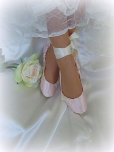 This lovely pale pink  bridal ballet style shoe  is an elegant and comfortable choice  to dance your way through your wedding day! Made of pale pink satin and embellished with hand made tulle roses, pearls and lace,  they are a tasteful compliment to almost any gown from casual to elegant.  Satin ribbon ties in a feminine bow around the ankle. Lined in satin and padded with cotton quilting , their comfort will allow you to enjoy your day to the fullest. Please see the last photos for visual instructions on how to measure your feet while standing with your weight on them. 1. LENGTH 2. WIDTH 3. TOP WIDTH 4. HEEL WIDTH 5. ANKLE  Please submit all measurements when placing your order and be reachable through an Etsy convo. Thanks for visiting my shop, be sure to look around! This shoe's faux s Wedding Ballerina, Ballet Wedding Shoes, Dancing Shoes Wedding, Ballet Wedding, Lace Bridal Shoes, Satin Ballet Flats, Liz Marie, Pink Wedding Shoes, Ballet Shoe