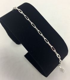 This bracelet is made with genuine sterling silver. The links are made in Paper clip style and are 2.5 in width. The weight of the bracelet is 2.7 grams and has a lobster lock. It is marked 925 for authenticity of metal. The bracelet looks beautiful by itself or with a little charm. Very classy and trendy! Classic Silver Chain Paperclip Bracelet With Oval Links, Silver Chain Bracelet With Paperclip Link, Classic Paperclip Bracelet With Oval Link Silver Chain, Classic Silver Paperclip Bracelet With Oval Links, Classic Silver Chain Link Paperclip Bracelet, Classic Sterling Silver Paperclip Chain Bracelet, Classic Silver Link Paperclip Bracelet, Classic Silver Paperclip Chain Bracelet, Minimalist Silver Oval Link Charm Bracelet