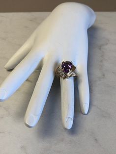 This beautiful 14kt Yellow Gold Lady's Diamond and Amethyst Ring consists of a 10mm x 15mm Genuine Pear Shape Amethyst Gemstone 5.00ct approx total weight and 4 diamond accents .05ct approx total weight all prong set in a fashion swirl solid mounting. Finger size 6 1/2 which can be resized. Amethyst is the Birthstone for February. This item would Retail for $1,250.00 Pear-shaped Purple Amethyst Ring With Prong Setting, Purple Pear-shaped Amethyst Ring With Prong Setting, Pear-shaped Amethyst Ring For Anniversary, Amethyst Gemstone, Amethyst Ring, Pear Shape, Gemstone Ring, Pear Shaped, Prong Setting