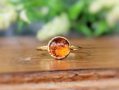 CUT-OFF DATE TO RECEIVE YOUR ORDER BY CHRISTMAS: Sunday December 10th, 2023 All orders received AFTER December 10th will be created and shipped after the Christmas Holidays. Nature Lovers will fall for this stunning Baltic Amber ring ! ❣  Our Honey color ring features a natural round Baltic amber stone - uniquely handcrafted by electroforming on a 14k Gold filled band plated in 18k Gold. This lovely Statement ring will be sure to make a perfect gift for any special occasions such as Birthday, An Gold Crystal Ring With Bezel Setting As Gift, Dainty Amber Round Jewelry, Dainty Round Amber Jewelry, Gold Solitaire Crystal Ring Gift, Yellow Gold Citrine Birthstone Ring For Gift, Yellow Gold Citrine Birthstone Ring As Gift, Round Citrine Jewelry Gift, Citrine Jewelry Gift With Round Shape, Citrine Jewelry Gift Round Shape