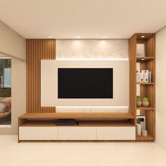 a modern living room with white walls and wooden entertainment center, built in bookshelves