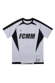 a white and black soccer jersey with the words fcm on it