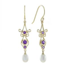 These pair of vintage-inspired amethyst and pearl earrings presents dazzling amethysts shimmer within ornate gold settings, evoking a sense of luxury and refinement. Delicate white freshwater pearls cascade gracefully below, adding a touch of sophistication and whimsical movement. Perfect for a grand entrance at a formal event or a statement piece for any special occasion, these earrings will elevate your look and turn heads wherever you go. CHARACTERISTICS Status: Made to order Origin: Thailand Elegant Amethyst Earrings For Formal Occasions, Elegant Purple Gemstone Pearl Earrings, Elegant Amethyst Jewelry, Elegant Amethyst Purple Earrings, Elegant Purple Pierced Earrings, Elegant Purple Amethyst Earrings, Elegant Purple Jewelry For Evening, Elegant Purple Jewelry For Formal Occasions, Elegant Evening Amethyst Jewelry