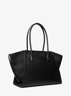 Equally versatile and sophisticated, our Avril tote is a must-have addition to your handbag lineup. Crafted from leather and suede, this gusseted design is rendered in a standout silhouette that’s generously sized to store a day’s worth of essentials. It’s the perfect complement to office-ready looks and casual weekend wear alike. Women Tote Bags, Slouchy Leather Tote, Mom Purses, Suede Tote Bag, Work Tote Bag, Grey Tote, Suede Tote, Work Tote, Luxury Purses