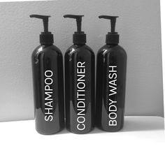 three black shampoos with the words body wash and conditioner written on them