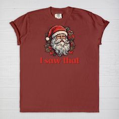 Spread holiday cheer with a humorous touch wearing our Santa 'I Saw That' T-shirt! Embrace the joy of the season with this whimsical tee featuring Santa's knowing gaze and the playful phrase 'I Saw That.' Crafted for comfort and a dash of festive humor, this tee is perfect for adding a light-hearted touch to your holiday wardrobe.Want to spend every day in the comfort of Saturday morning? Slip on a Comfort Colors 1717 Adult Tee and enjoy the softness of 100% USA grown ring-spun cotton. The fabri Fun Christmas Crew Neck T-shirt, Fun Christmas T-shirt With Graphic Print, Fun Red T-shirt, Funny Crew Neck T-shirt For Gifts, Christmas Cotton T-shirt With Screen Print, Funny Holiday T-shirt With Graphic Print, Funny Graphic Print T-shirt For Holidays, Holiday Graphic Tee With Funny Print, Holiday Cotton T-shirt Pre-shrunk