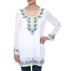 Floral motifs dazzle in perfect harmony as colorful glass beads grace this beautiful tunic by India's Sandip Agarwal. The white polyester blouse features the intricate hand-beading along the neckline hem and sleeves. The top is lined with cotton. White Bollywood Festive Top, Festive Embellished Long Sleeve Tunic, Long Sleeve Embellished Festive Tunic, Festive Long Sleeve Embellished Tunic, White Floral Embroidered Tunic For Festive Occasions, White Floral Embroidered Festive Tunic, Festive White Tunic With Resham Embroidery, Festive White Tunic With Floral Embroidery, Traditional White Top With Mirror Work