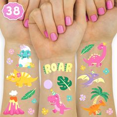 three girls with pink fingernails and tattoos on their arms