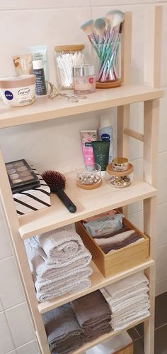 a bathroom shelf filled with lots of personal care items