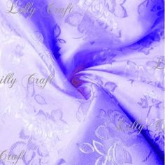 an image of a purple and white fabric with floral design on the bottom, as well as