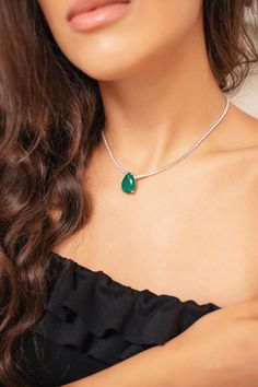 Our Oval Green Tennis Choker necklace exudes a vintage-inspired glamor that is timeless yet contemporary, making it the perfect complement to your wardrobe and next special occasion. A classic chain and luscious green solitaire stone become the main focal point, all crafted with 925 sterling silver. Metal Type: 925 Sterling Silver Length: 13"+2" Elegant Emerald Necklace With Clavicle Chain In Sterling Silver, Elegant Sterling Silver Emerald Necklace With Clavicle Chain, Elegant Emerald Necklace With Adjustable Chain For May Birthstone, Elegant Green Oval Necklace, Luxury Green Teardrop Pendant Necklace, Oval Fine Jewelry Necklace For Parties, Green Sterling Silver Necklace With Jewels, Oval Emerald Necklace With 17 Jewels, Green Emerald Necklace With Cubic Zirconia