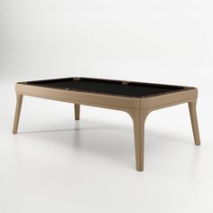 a pool table with a black cloth on the top and two legs, in front of a white background