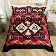 a red and black plaid bed set with bear paw prints