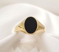 This ring is made of 14K yellow solid gold with oval shaped black onyx at the top. The onyx is a very hard stone, difficult to scratch. This makes it a perfect choice for everyday use. The ring can be resized for your finger size. ❥ Free Express International Shipping ❥ Free Return within 5 days from the receiving day in case the jewel does not correspond to our site description. Features * Material: Solid 14K Yellow Gold * Gem Stones: Black Onyx * Ready to Ship in 1-3 Business Days ❥ Safety My Oval Yellow Gold Signet Ring With Black Enamel, Black 14k Stamped Signet Ring As Gift, Black 14k Stamped Signet Ring For Gift, Pinky Finger Ring, Mens Signet Ring, Greek Ring, Pinky Finger, Expensive Rings, Signet Ring Men