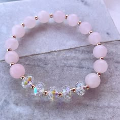 8mm matte rose quartz made with 8mm swarovski crystal rondelles Classy Jewellery, Daughter Ring, Girly Bracelets, Pearl Art, Crystal Bead Jewelry, Crystal Anklet, Stone Bracelets, Swarovski Crystal Jewelry, Diy Bracelet Designs